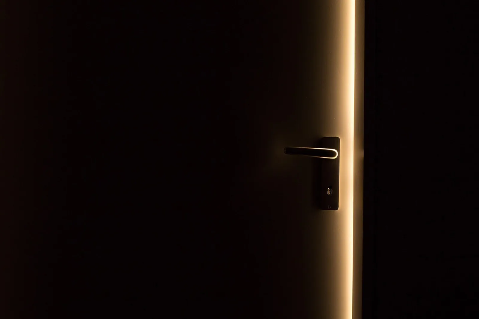 Woman calmly touching a door handle before a meeting, a trigger for a post hypnotic suggestion