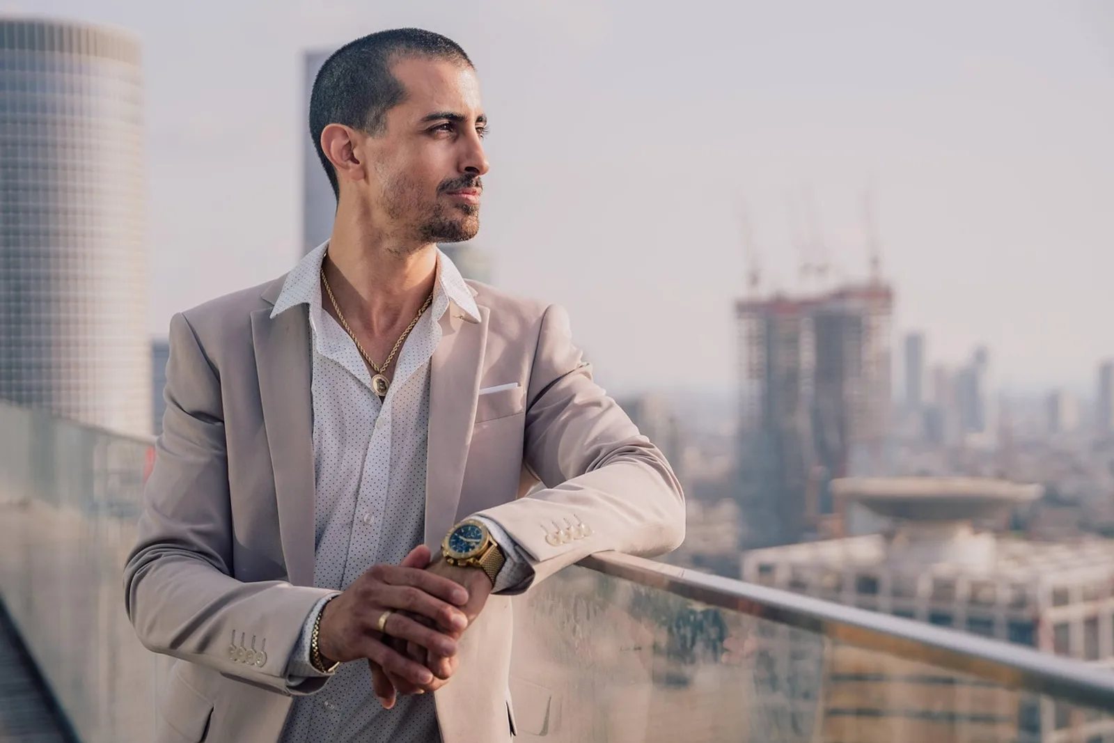 Man taking a micro-break on a rooftop terrace, short breaks help you handle work pressure